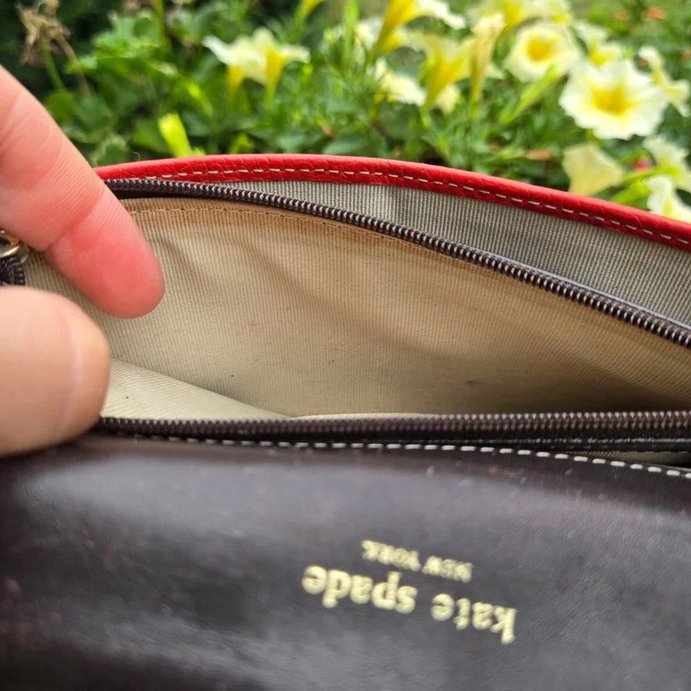 kate spade bifold pebble leather wallet. In red. Flaws